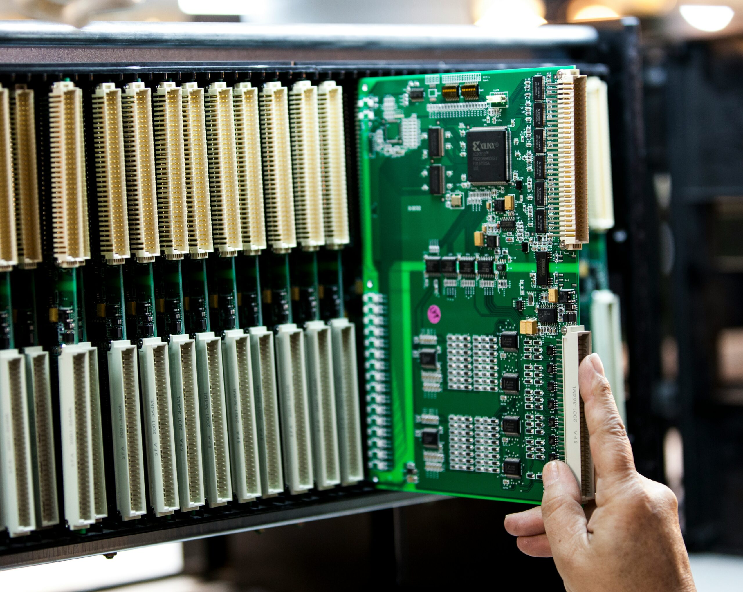 Electronics manufacturing technician working on PCB assembly